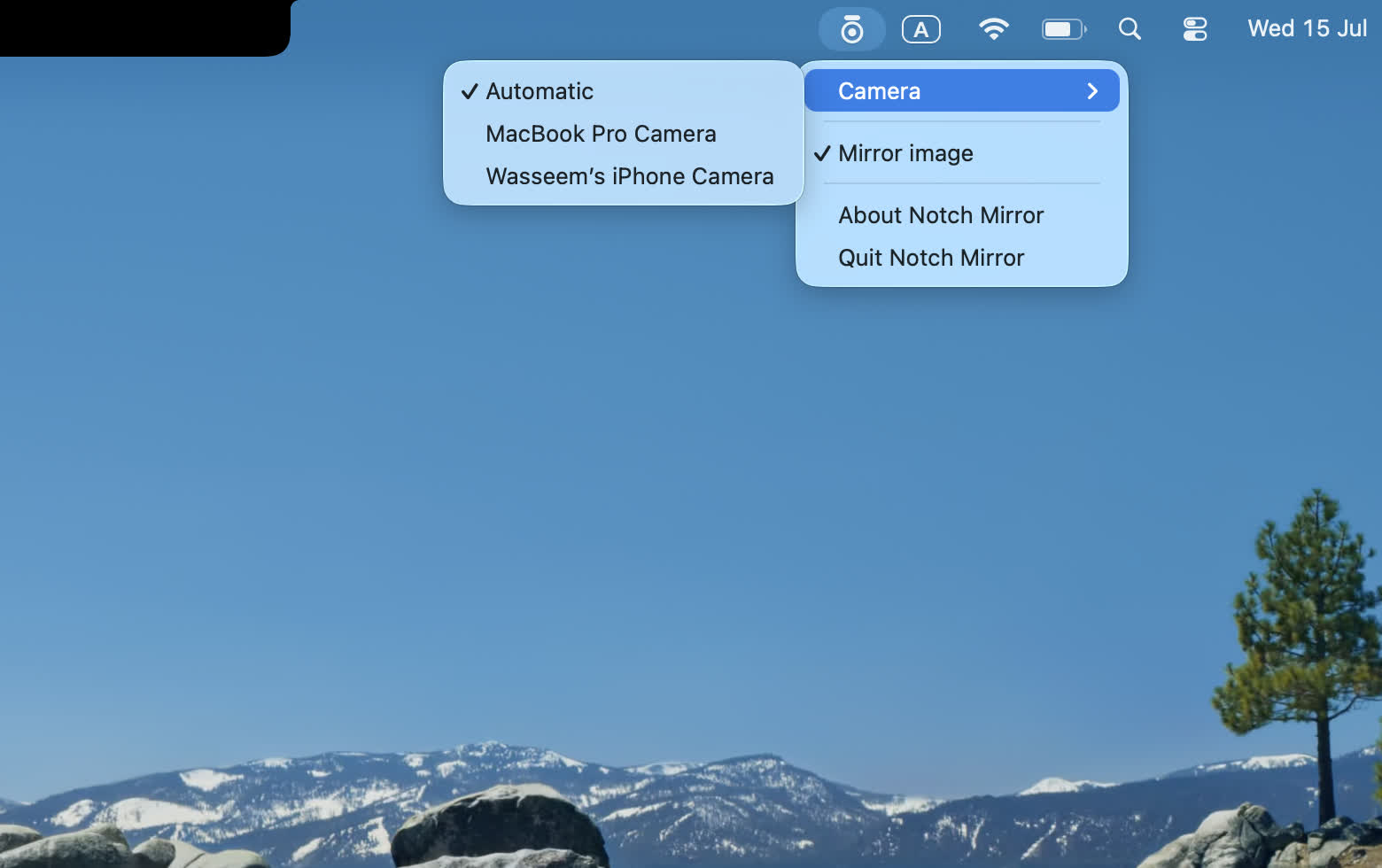 The menu-bar camera picker showing the built-in camera and an iPhone via Continuity Camera, plus a Mirror image toggle